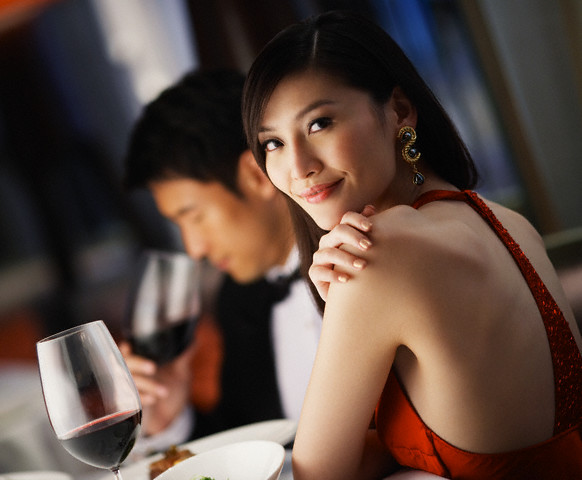Couple Having Romantic Dinner --- Image by © Ken Seet/Corbis